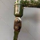 Donkergroene drie-arms Mek Elek machinelamp