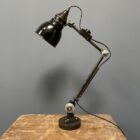 Vroeg model Rademacher tafellamp met zwart emaille kap