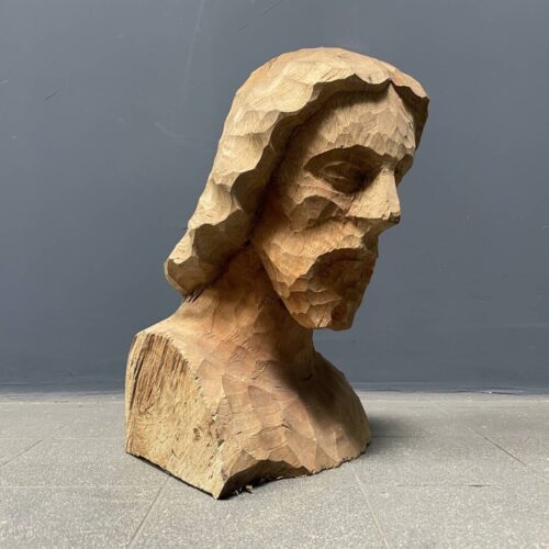 Uit hout gesneden hoofd of buste van een man met baard